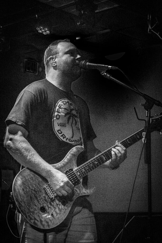 Man playing guitar.